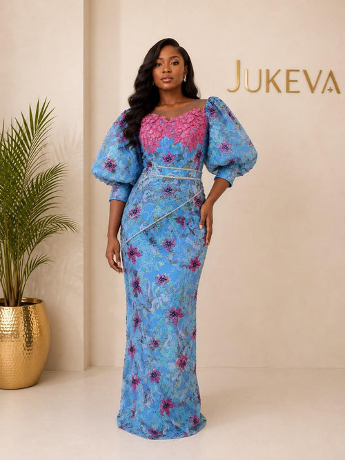 Azure blue lace aso ebi gown with pink appliqué and puff sleeves by Jukeva